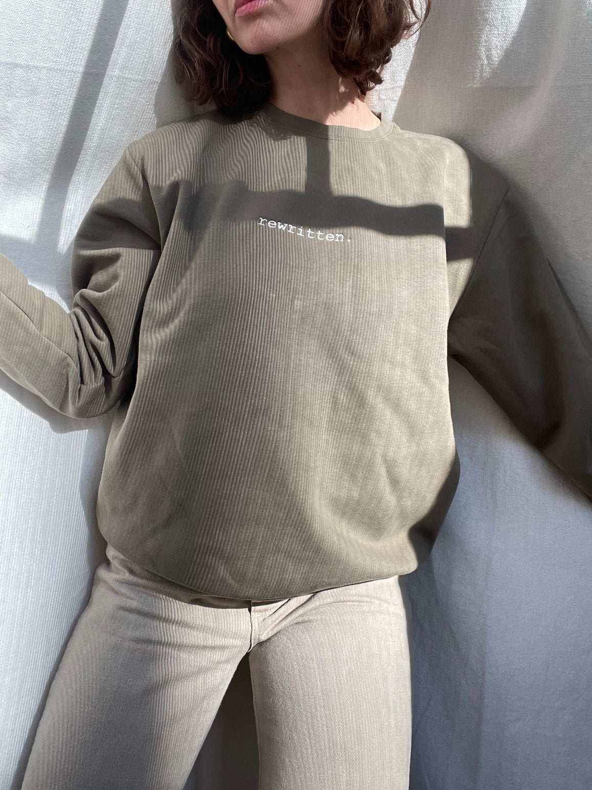 rewritten. unisex sweatshirt