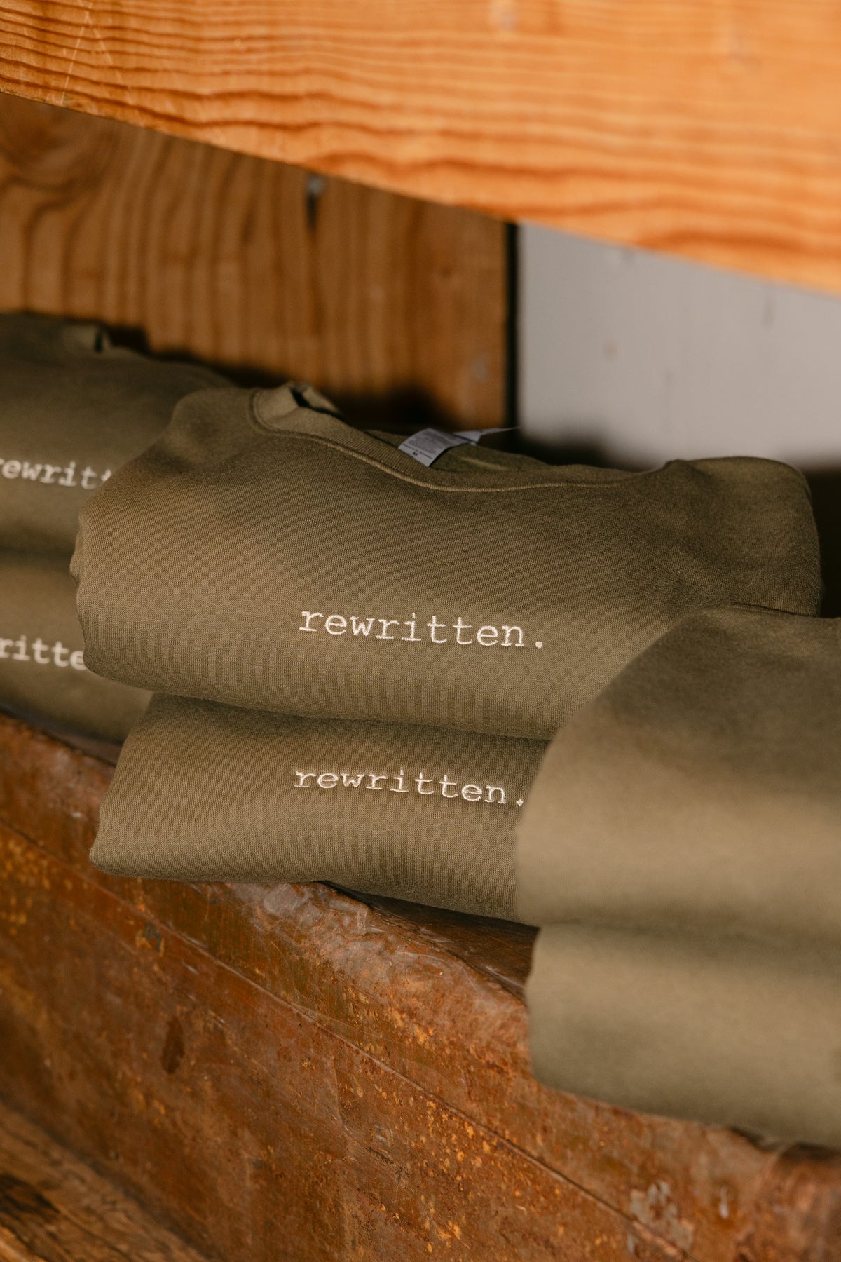 rewritten. unisex sweatshirt